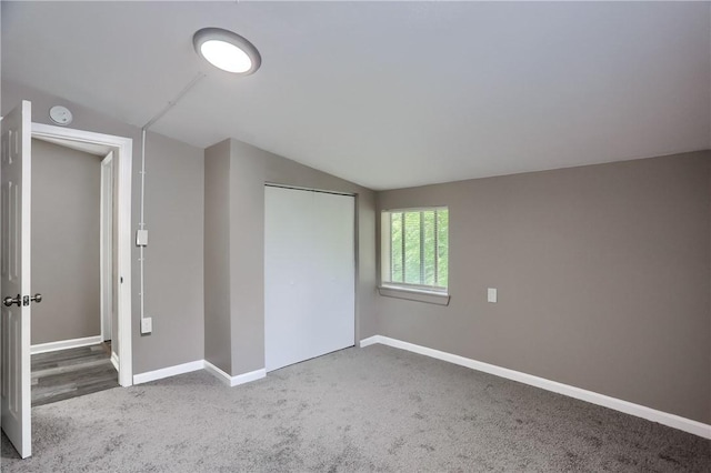 505 Bellwood Rd, West Mifflin, PA 15122 - unfurnished bedroom featuring vaulted ceiling, carpet floors, and a closet
