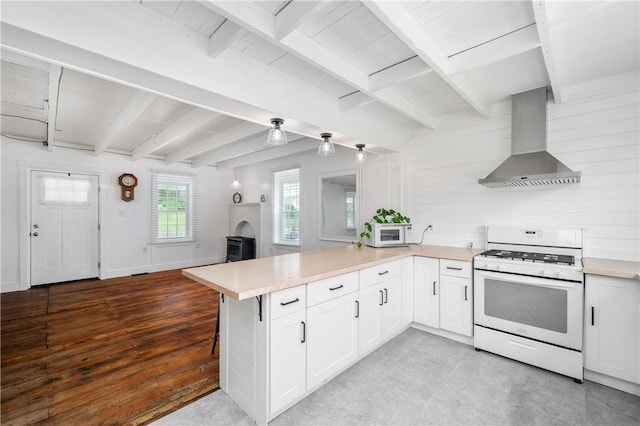 221 Connoquenessing Main St, Connoquenessing Boro, PA 16027 - kitchen with white appliances, wall chimney range hood, a peninsula, light countertops, and beam ceiling