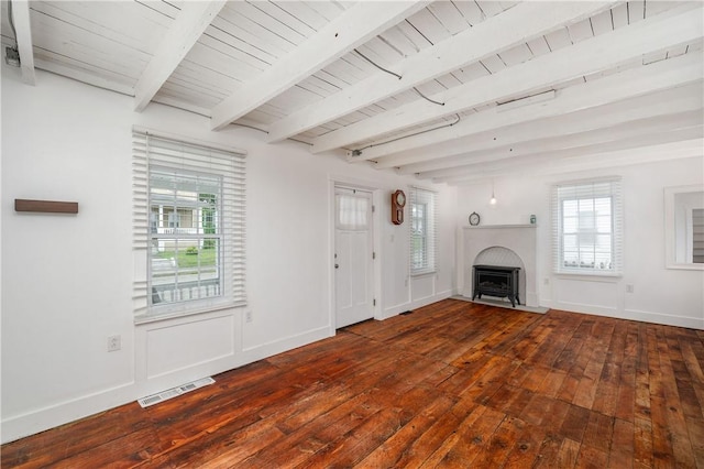 221 Connoquenessing Main St, Connoquenessing Boro, PA 16027 - unfurnished living room featuring hardwood / wood-style flooring, a fireplace with flush hearth, and a wooden ceiling with exposed beams