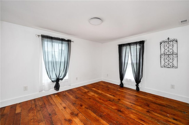 221 Connoquenessing Main St, Connoquenessing Boro, PA 16027 - empty room with dark wood-style flooring and baseboards