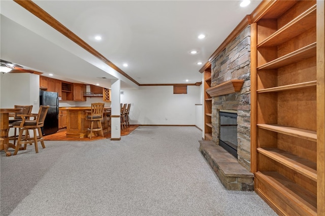 215 Lafayette Dr, Cranberry Twp, PA 16066 - living area with light carpet, recessed lighting, crown molding, bar area, and a fireplace