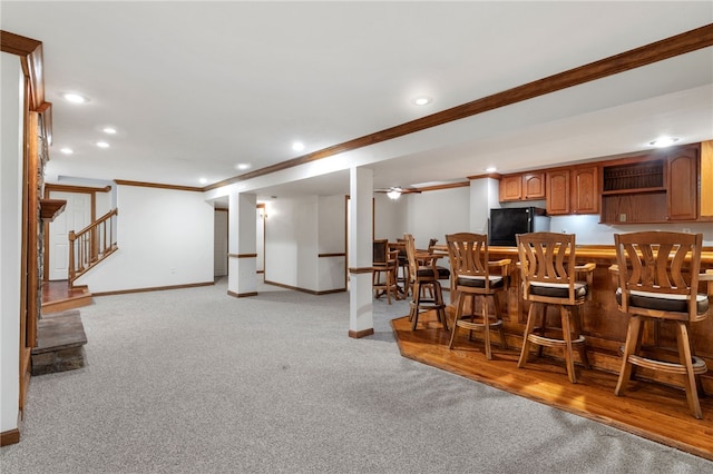 215 Lafayette Dr, Cranberry Twp, PA 16066 - kitchen with crown molding, freestanding refrigerator, recessed lighting, light colored carpet, and brown cabinetry