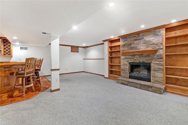 215 Lafayette Dr, Cranberry Twp, PA 16066 - living area with carpet floors, recessed lighting, ornamental molding, a bar, and a stone fireplace