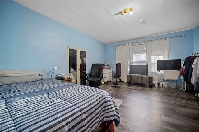 206 7th St, Oakmont, PA 15139 - bedroom with radiator heating unit and wood finished floors