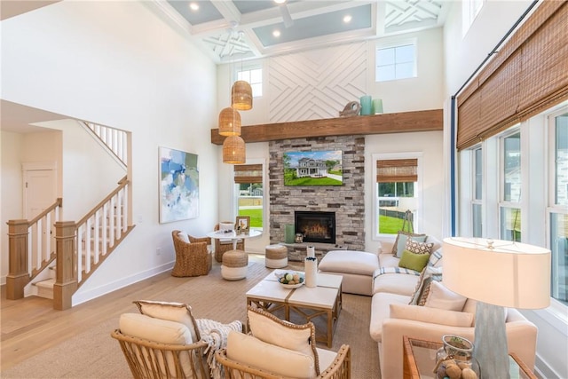 287 Mcmurray Rd, Saint Clair, PA 15241 - living room featuring a towering ceiling, wood finished floors, stairs, beamed ceiling, and coffered ceiling