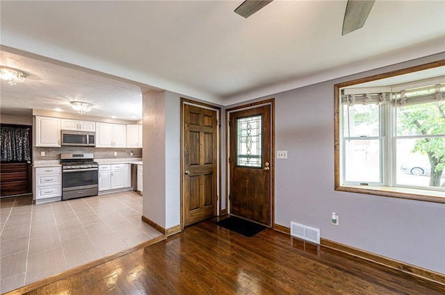 12220 Herold Dr, North Huntingdon, PA 15642 - entryway featuring plenty of natural light and wood finished floors
