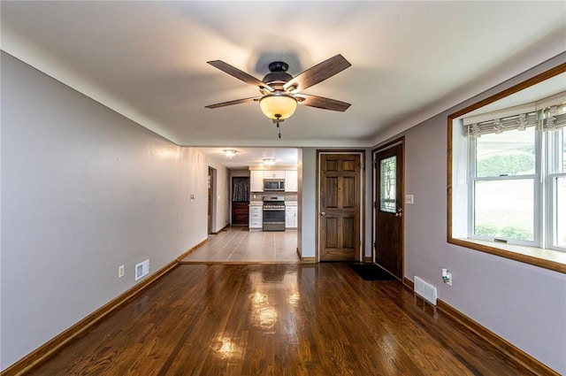 12220 Herold Dr, North Huntingdon, PA 15642 - unfurnished living room with dark wood finished floors and ceiling fan