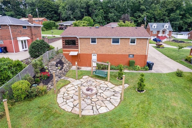 12220 Herold Dr, North Huntingdon, PA 15642 - back of property featuring brick siding, a lawn, and a patio