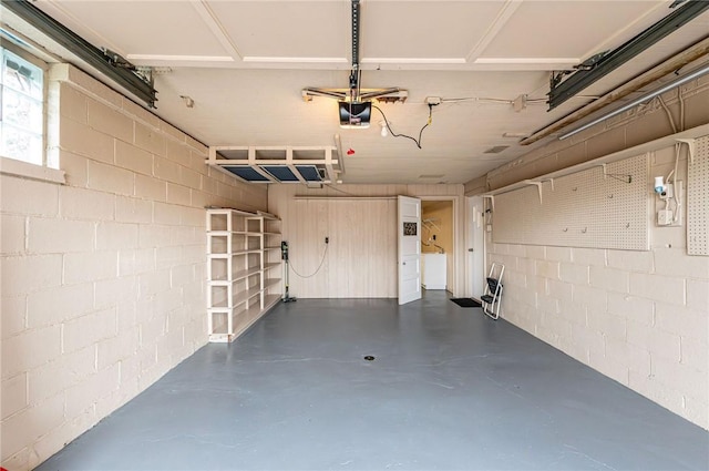 12220 Herold Dr, North Huntingdon, PA 15642 - garage featuring concrete block wall and a garage door opener