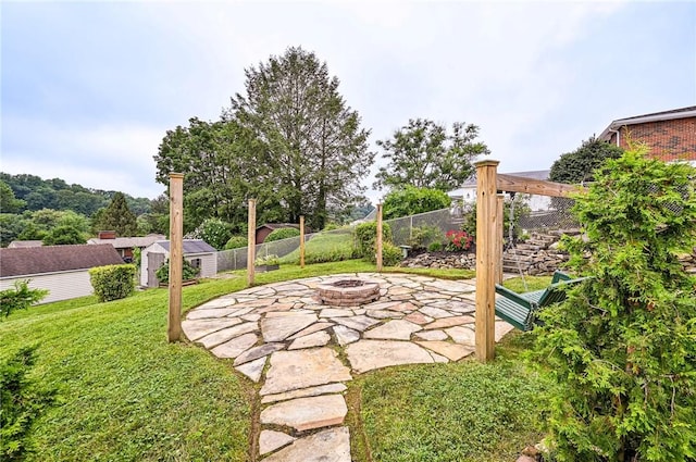 12220 Herold Dr, North Huntingdon, PA 15642 - view of yard with an outdoor fire pit, a patio, and a storage unit