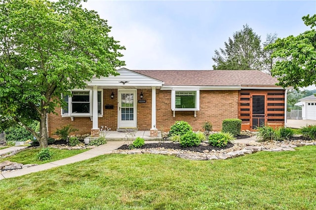 12220 Herold Dr, North Huntingdon, PA 15642 - view of front facade featuring a front lawn and brick siding
