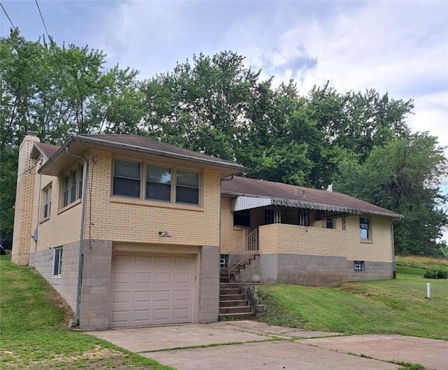 120 Rothen Ave, Twp Of But Nw, PA 16001 - view of front of house with a front lawn, an attached garage, driveway, brick siding, and stairs