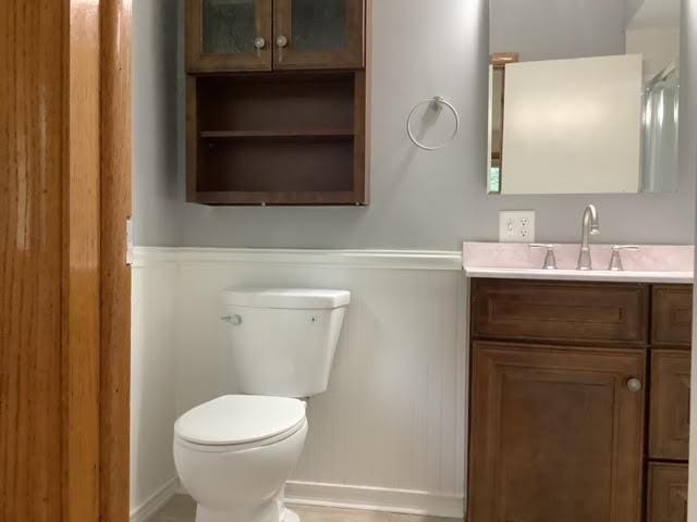120 Rothen Ave, Twp Of But Nw, PA 16001 - bathroom with vanity and a wainscoted wall