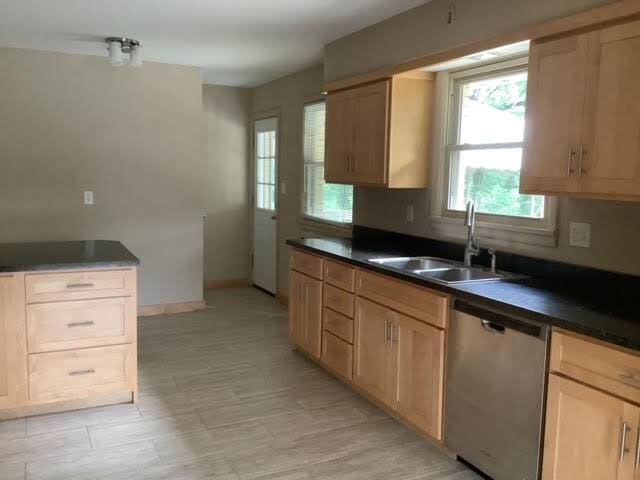 120 Rothen Ave, Twp Of But Nw, PA 16001 - kitchen with stainless steel dishwasher, dark countertops, and light brown cabinets