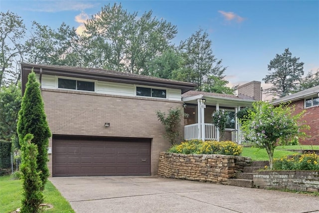 4952 Flamingo Dr, Whitehall, PA 15236 - tri-level home with brick siding, a garage, and concrete driveway