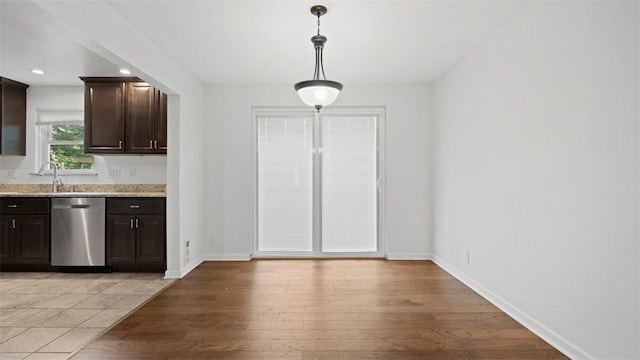 4952 Flamingo Dr, Whitehall, PA 15236 - kitchen with stainless steel dishwasher, dark brown cabinetry, decorative light fixtures, light wood finished floors, and recessed lighting