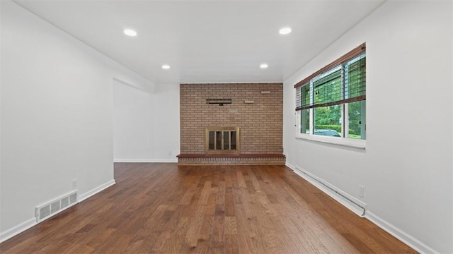 4952 Flamingo Dr, Whitehall, PA 15236 - unfurnished living room with wood finished floors, a fireplace, and recessed lighting