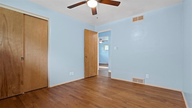 4952 Flamingo Dr, Whitehall, PA 15236 - unfurnished bedroom with wood finished floors, a closet, and a ceiling fan