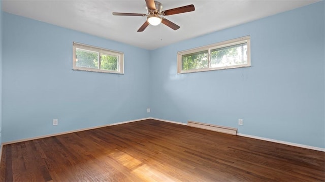 4952 Flamingo Dr, Whitehall, PA 15236 - spare room with a baseboard radiator, healthy amount of natural light, wood finished floors, and a ceiling fan