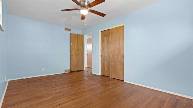 4952 Flamingo Dr, Whitehall, PA 15236 - unfurnished bedroom featuring wood finished floors, a closet, and a ceiling fan