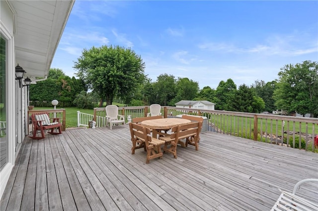 1146 Middletown, Hempfield Twp, PA 15601 - deck featuring outdoor dining area, a lawn, view of wooded area, and an outbuilding
