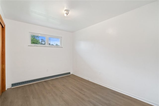 1146 Middletown, Hempfield Twp, PA 15601 - unfurnished bedroom featuring a baseboard radiator, wood finished floors, and a closet