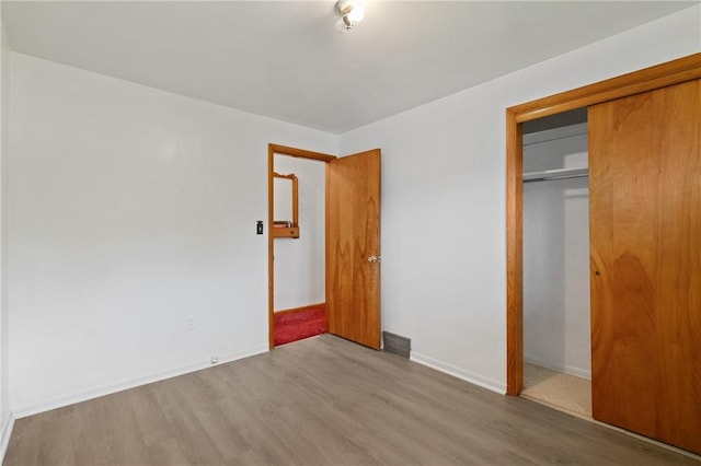 1146 Middletown, Hempfield Twp, PA 15601 - unfurnished bedroom featuring a closet and wood finished floors