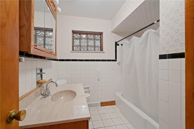1146 Middletown, Hempfield Twp, PA 15601 - full bath featuring wallpapered walls, tile patterned floors, vanity, tile walls, and shower / bath combo with shower curtain