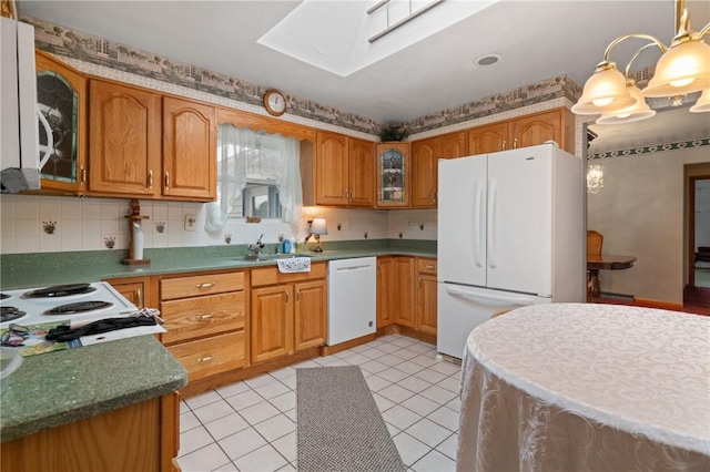 1146 Middletown, Hempfield Twp, PA 15601 - kitchen with white appliances, a skylight, glass insert cabinets, and brown cabinetry
