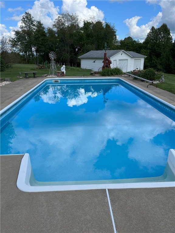 1146 Middletown, Hempfield Twp, PA 15601 - outdoor pool with a lawn, an outbuilding, and view of wooded area
