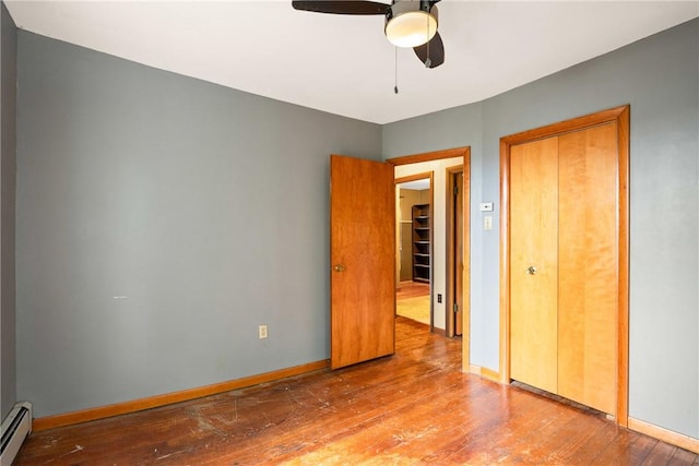 769 Russell Ave, Greater Johnstown School District, PA 15902 - unfurnished bedroom featuring hardwood / wood-style floors, a baseboard heating unit, and ceiling fan