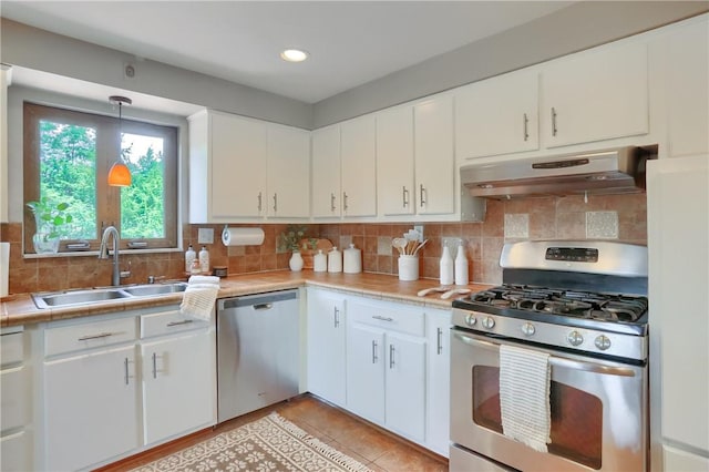 2116 Stewart Rd, South Park, PA 15129 - kitchen with appliances with stainless steel finishes, under cabinet range hood, light countertops, tasteful backsplash, and recessed lighting