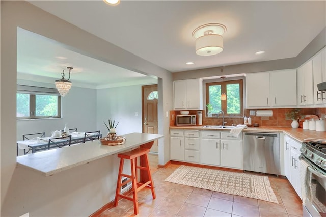 2116 Stewart Rd, South Park, PA 15129 - kitchen featuring stainless steel appliances, healthy amount of natural light, light countertops, and recessed lighting