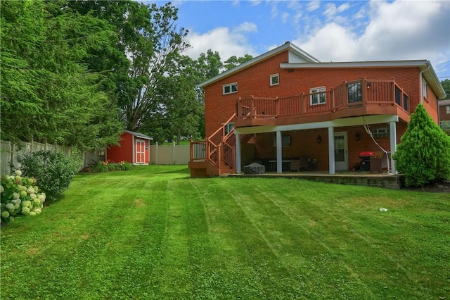 2116 Stewart Rd, South Park, PA 15129 - rear view of house featuring brick siding, a storage unit, a wooden deck, a patio, and stairway