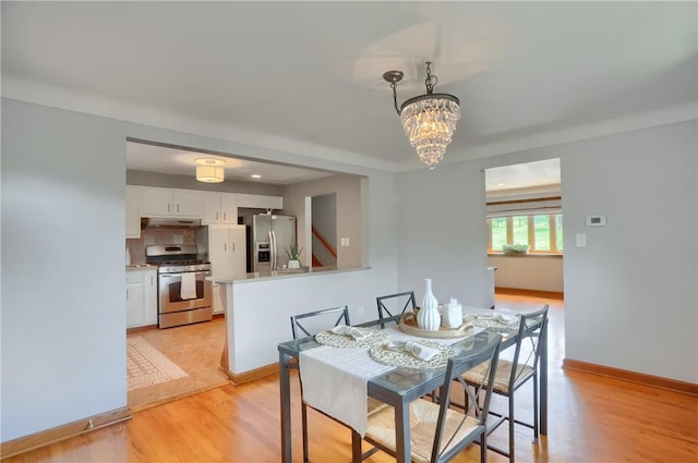 2116 Stewart Rd, South Park, PA 15129 - dining space with a chandelier and light wood-type flooring