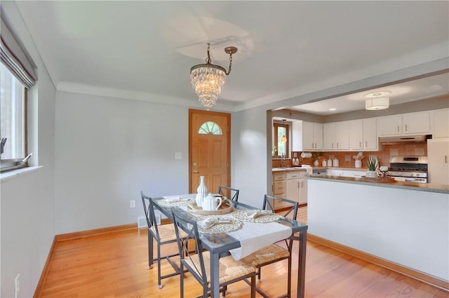 2116 Stewart Rd, South Park, PA 15129 - dining room with a chandelier and light wood-type flooring