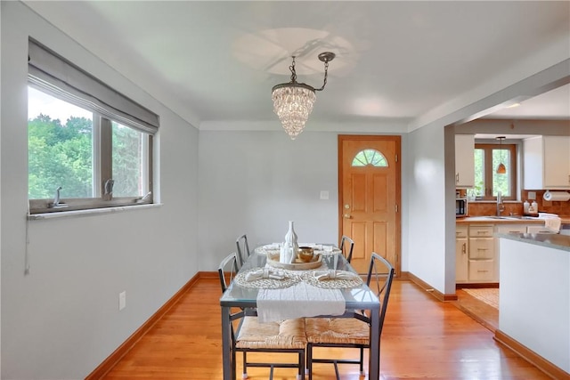 2116 Stewart Rd, South Park, PA 15129 - dining room with a chandelier and light wood-style floors