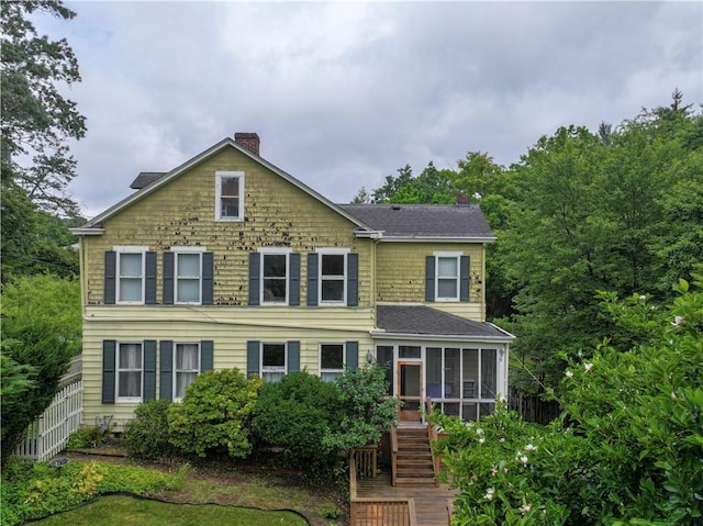 2507 Duncan Ave, Hampton, PA 15101 - view of front of house with a sunroom, a chimney, stairway, and roof with shingles