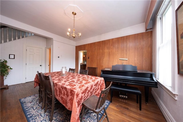 2507 Duncan Ave, Hampton, PA 15101 - dining space featuring a chandelier, wood finished floors, and wood walls
