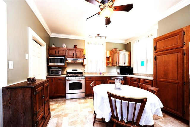 2507 Duncan Ave, Hampton, PA 15101 - kitchen featuring appliances with stainless steel finishes, ceiling fan, crown molding, under cabinet range hood, and light countertops