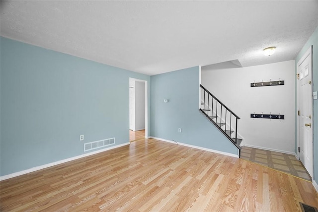 301 Laporte Ct, Cranberry Twp, PA 16066 - unfurnished living room with wood finished floors and stairs