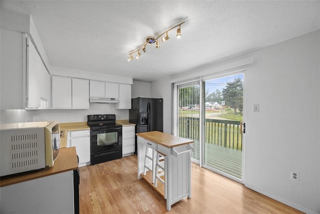 301 Laporte Ct, Cranberry Twp, PA 16066 - kitchen featuring black appliances, under cabinet range hood, white cabinetry, light wood-type flooring, and a textured ceiling