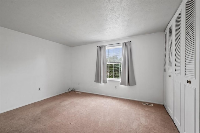 301 Laporte Ct, Cranberry Twp, PA 16066 - unfurnished bedroom featuring carpet, a textured ceiling, and a closet