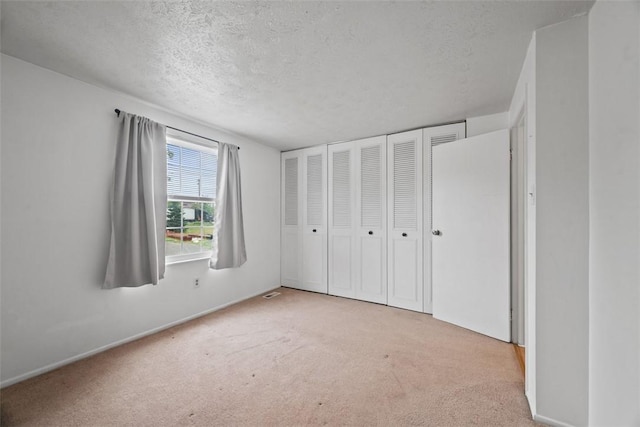 301 Laporte Ct, Cranberry Twp, PA 16066 - unfurnished bedroom with carpet floors, a textured ceiling, and a closet