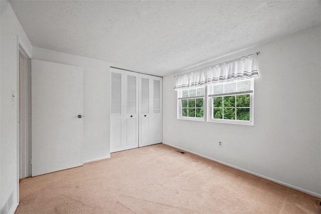 301 Laporte Ct, Cranberry Twp, PA 16066 - unfurnished bedroom featuring carpet, a closet, and a textured ceiling