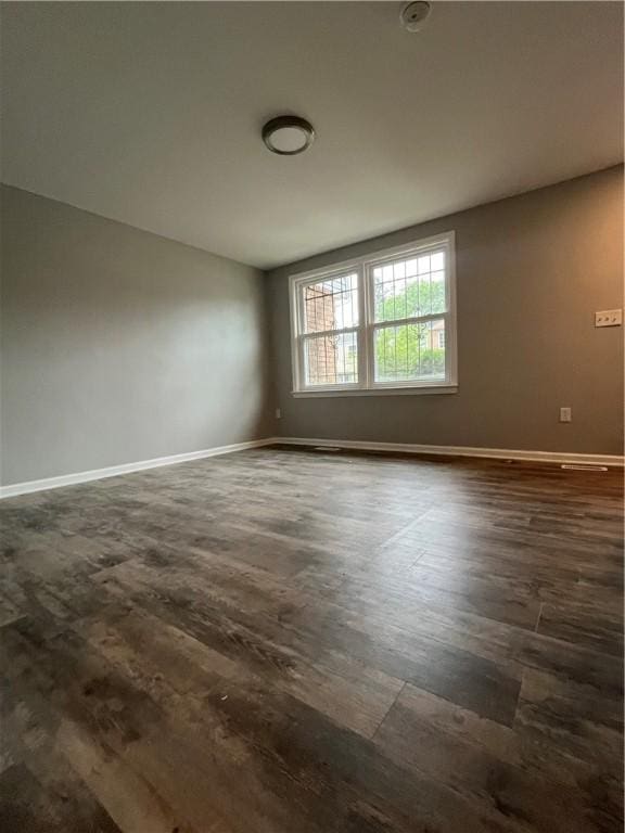 446 Enright Ct, East Liberty, PA 15206 - unfurnished room with baseboards and dark wood-type flooring