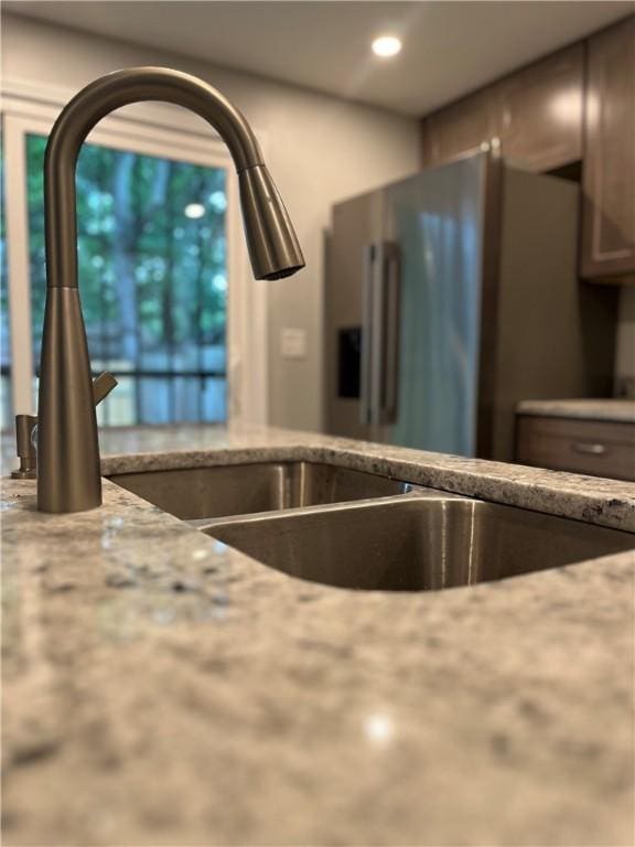446 Enright Ct, East Liberty, PA 15206 - kitchen view of stainless steel fridge with ice dispenser, light stone countertops, and recessed lighting