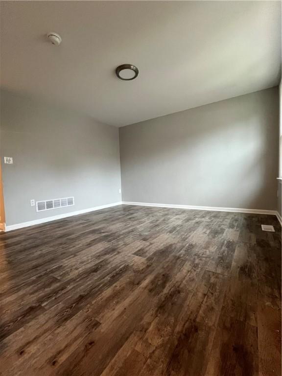446 Enright Ct, East Liberty, PA 15206 - spare room with dark wood-style flooring and a smoke detector