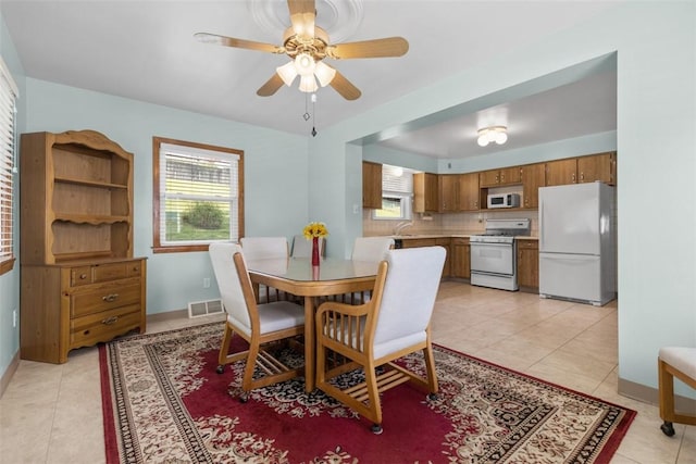 3040 Broadway Ave, Castle Shannon, PA 15234 - dining area with ceiling fan and light tile patterned floors