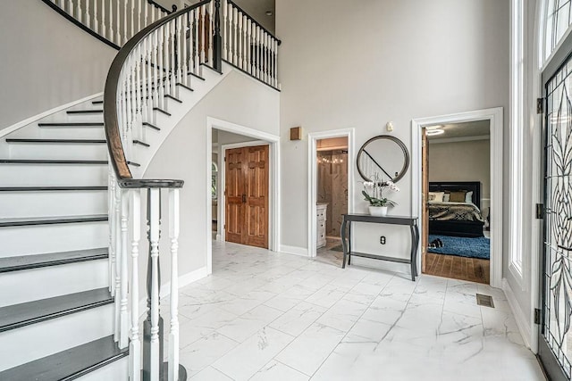 117 Cidar Ln, Peters Twp, PA 15317 - entrance foyer featuring marble look tiles, a high ceiling, and stairs